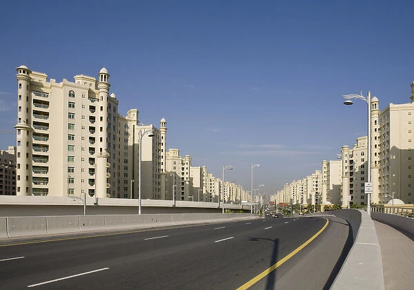 United Arab Emirates, Dubai. Road into the Palm Jumeirah with apartment buildings