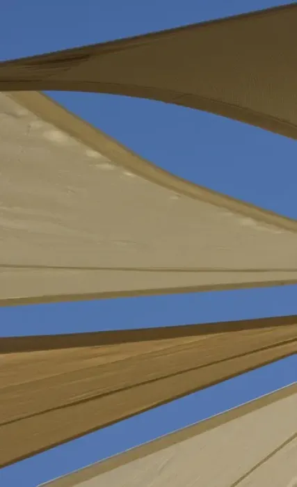 Framed Print : United Arab Emirates, Fujairah. Sand-colored canvas awnings under blue sky. Credit as