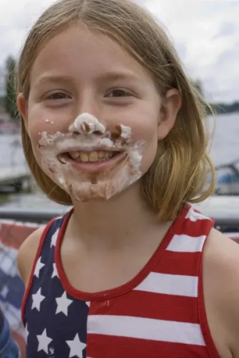 Framed Print : United States, Washington, Black Diamond, Girl (age 7) with pie on face, in American flag shirt Framed Print : United States, Washington, Black Diamond, Girl (age 7) with pie on face, in American flag shirt