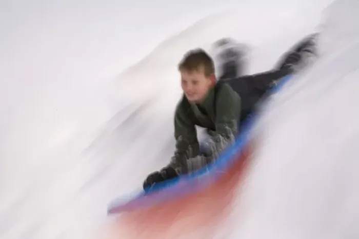 Framed Print : United States, Washington, Crystal Mountain, boy on sled in motion (MR) Framed Print : United States, Washington, Crystal Mountain, boy on sled in motion (MR)