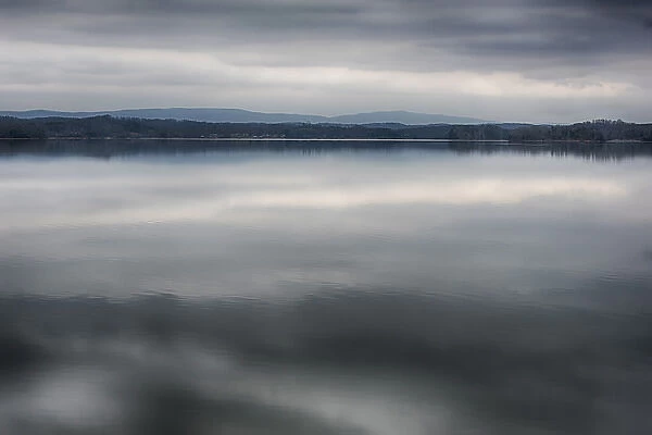 US, TN, Watts Bar Lake. Glass calm reflects cloud patterns