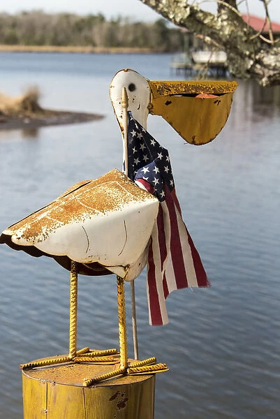 USA, Alabama. Whimsical pelican sculpture with American flag
