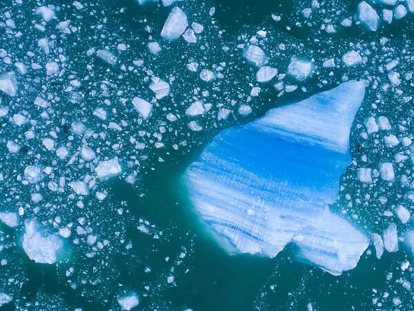 USA, Alaska, Aerial view of shattered icebergs floating near calving face of LeConte