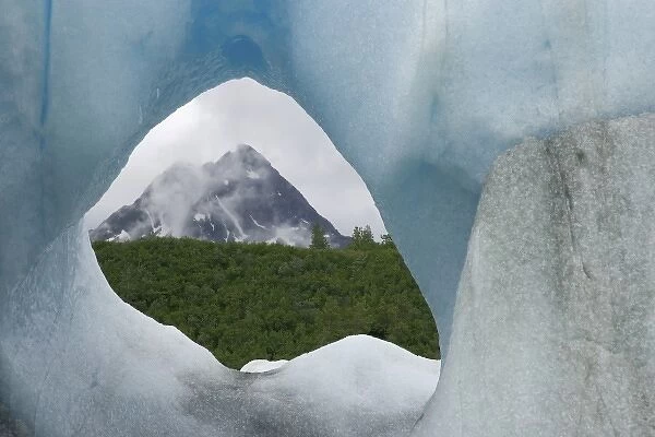 USA, Alaska, Alsek Lake. Mountain framed by iceberg
