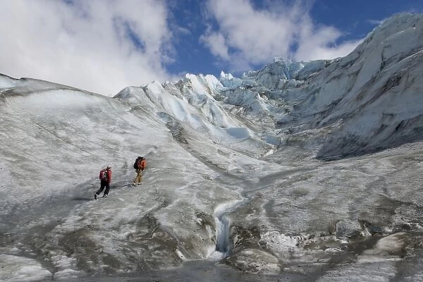 USA, Alaska, Alsek River Valley. Hikers climbing the Walker Glacier