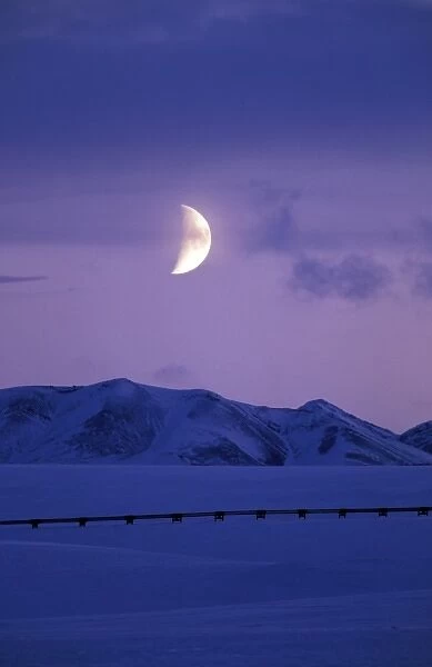 USA, Alaska, Brooks Range. Moon rises over the Trans-Alaskan Pipeline