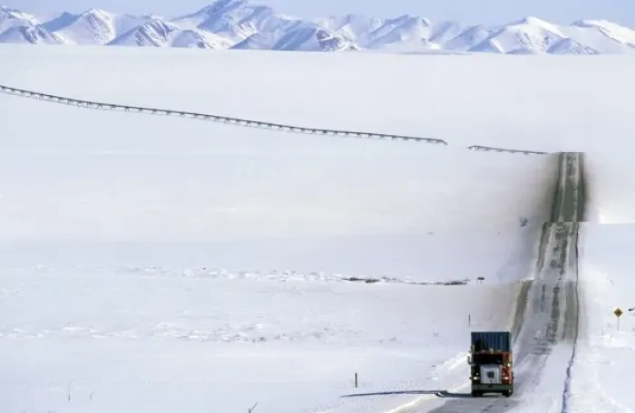 Framed Print : USA, Alaska, Brooks Range. Truck drives on the ice covered haul road to Prudhoe Bay