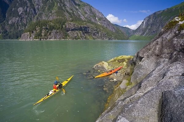 USA, Alaska, Endicott Arm, Fords Terror. Sea kayaker in steep-walled Fords Terror