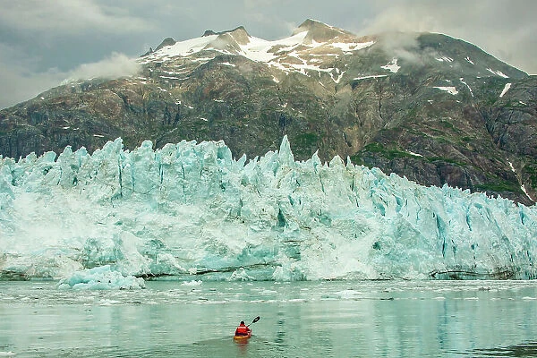 USA, Alaska, Glacier Bay National Park. Margerie Glacier ice and man in kayak