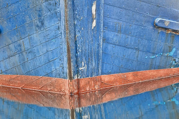 USA, Alaska, Hoonah. Abstract of fishing boat bow reflecting in water. Credit as