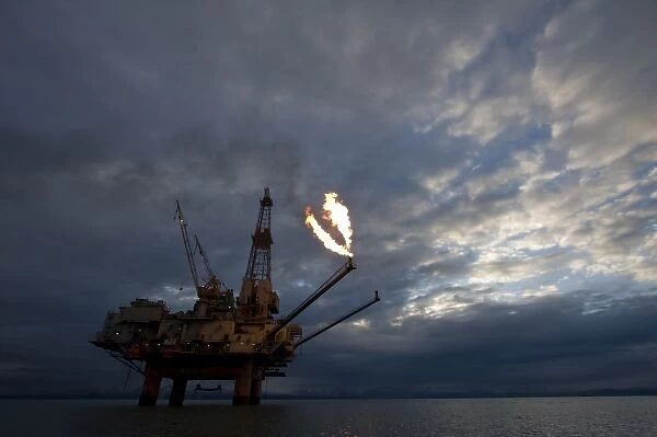 USA, Alaska, Kenai Peninsula, Natural gas flare from offshore oil drilling rigs in