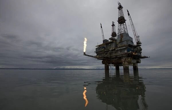 USA, Alaska, Offshore oil drilling rig with burning natural gas flare in Cook Inlet