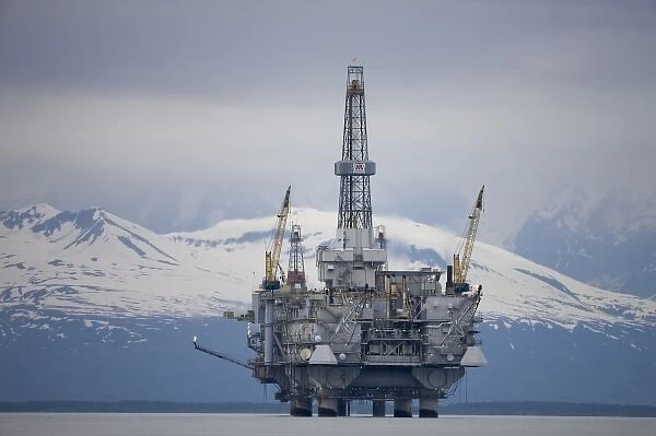 USA, Alaska, Offshore oil drilling rig in Cook Inlet and distant Alaska Range peaks