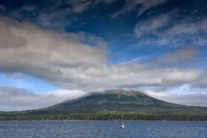 Framed Print : Usa, Alaska. This perfect volcano rises from the sea near Sitka. A fishing troller is in the foreground