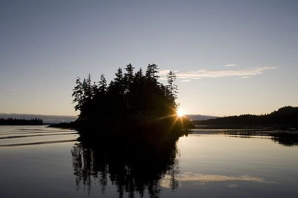 USA, Alaska, Setting sun lights islands along Frederick Sound