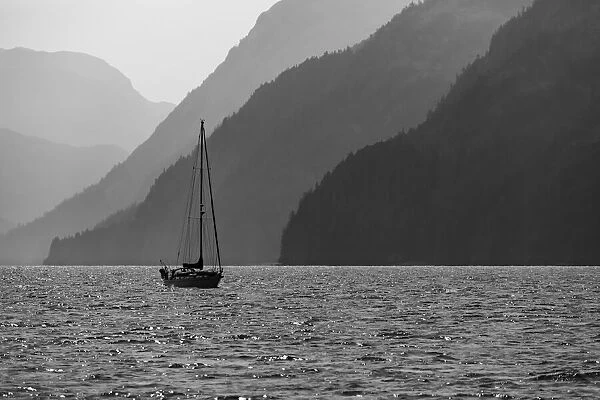 USA, Alaska, Tongass National Forest. B&W of sailboat in Lisianski Inlet