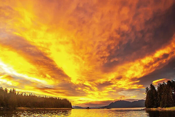 USA, Alaska, Tongass National Forest. Sunset on Admiralty Island and inlet