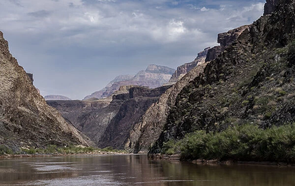 USA, Arizona. Floating down the Colorado River surrounded by canyon walls