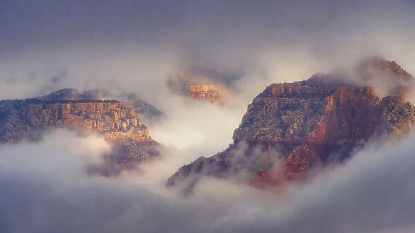 USA, Arizona, Grand Canyon. Foggy sunrise on canyon