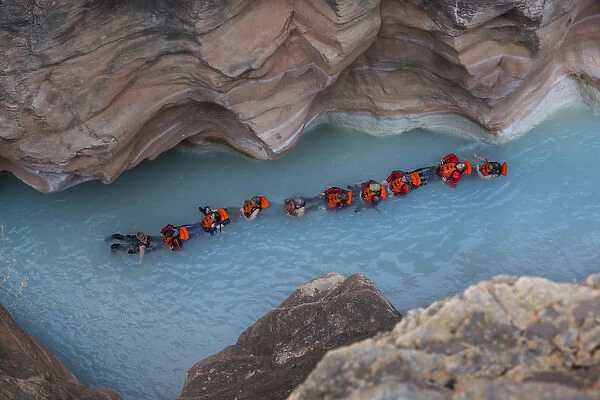 USA, Arizona, Grand Canyon National Park. Students float on blue water of Havasu Creek