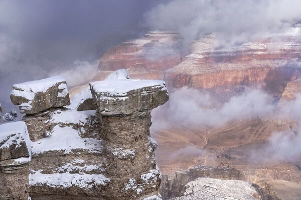 USA, Arizona, Grand Canyon National Park. Winter snowstorm over canyon