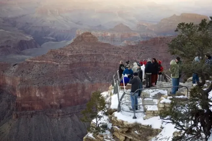 Framed Print : USA, Arizona, Grand Canyon National Park. Visitors at Yavapai Point for sunrise in winter