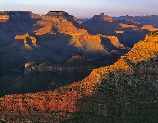 USA, Arizona, Grand Canyon NP. Just the tops of the mesas are lit at sunset at the