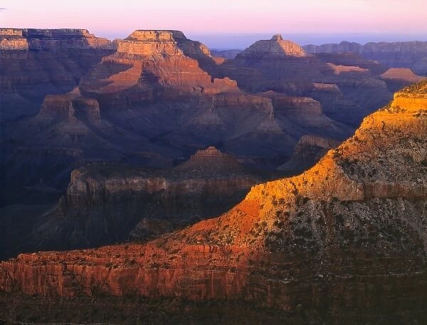 USA, Arizona, Grand Canyon NP. The last light of day catches the tops of the mesas at Mather Point