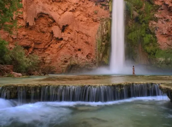 Framed Print : USA, Arizona, Havasu Canyon. A bikini-clad woman wades through the creek below thundering Framed Print : USA, Arizona, Havasu Canyon. A bikini-clad woman wades through the creek below thundering