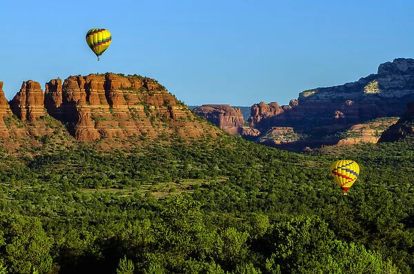 USA, Arizona. Hot-air balloons floats over Red Rocks State Park