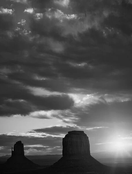 USA, Arizona, Monument Valley. Black and white of sunrise silhouettes of formations