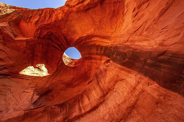 USA, Arizona, Monument Valley Navajo Tribal Park. Big Hogan Arch and hole in rock