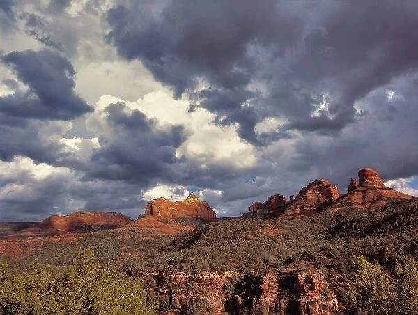 USA, Arizona, Oak Creek Canyon. An early spring storm passes over the red rock monoliths