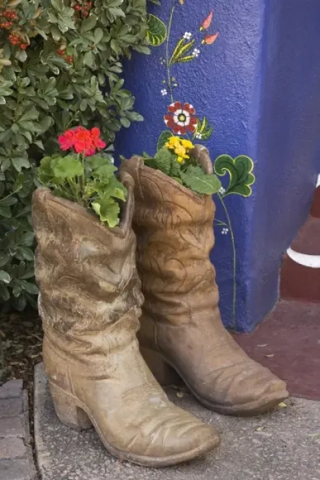 Framed Print : USA, Arizona, Tucson. Cowboy boots used as planters on porch of Hacienda Del Sol Guest Ranch Resort