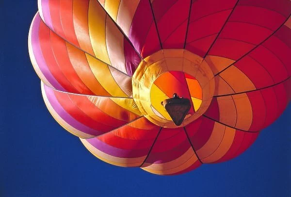 USA, Arizona, Val Vista. A colorful hot-air balloon floats above Val Vista near Mesa, Arizona