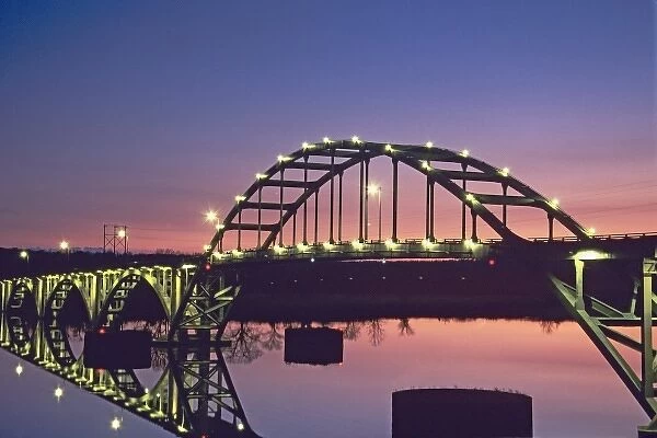 USA, Arkansas, Ozark. View of the Ozark Bridge across the Arkansas River at twilight