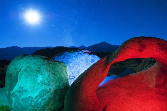 Framed Print : USA, California, Alabama Hills. Mobius Arch and rocks lit with colors on moonlit night