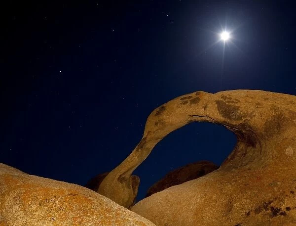 USA, California, Alabama Hills. Moonrise behind Mobius Arch near Lone Pine