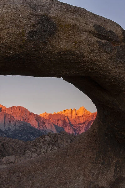 USA, California, Alabama Hills. Mt. Whitney seen through Mobius Arch at sunrise. Credit as