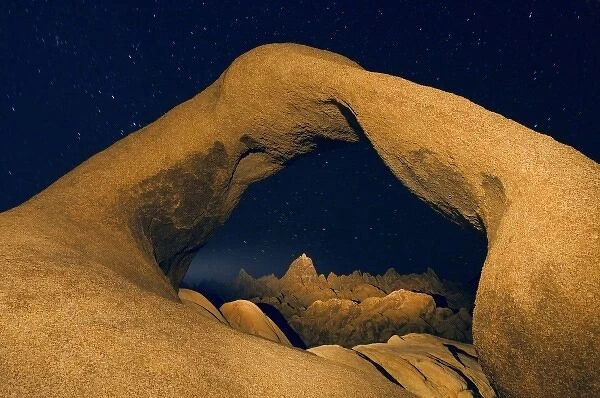 USA, California, Alabama Hills. Night exposure of Mobius Arch illuminated by flashlight