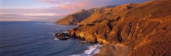 USA, California, Big Sur. Sunset casts a golden hue over the Coast Range near Big Sur