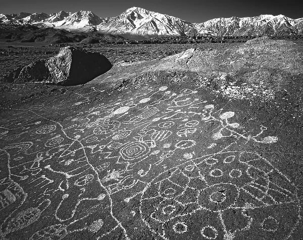 USA, California, Bishop. Petroglyphs on rock face