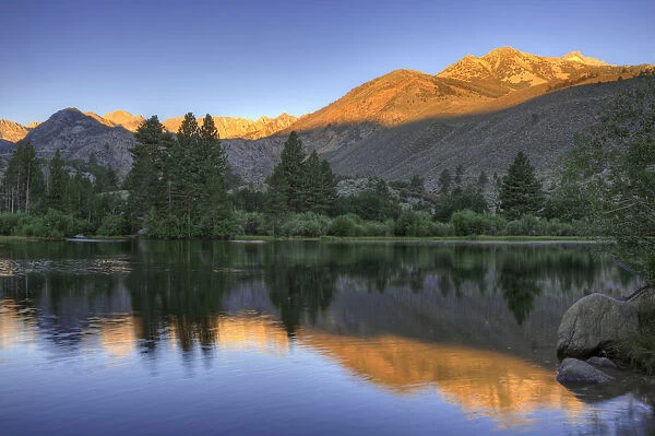 USA, California, Bishop. Sunrise on mountain lake