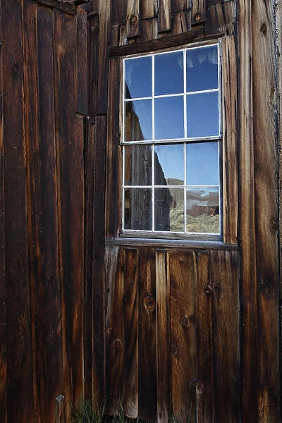 USA, California, Bodie State Historic Park. Weathered window in abandoned town. Credit as