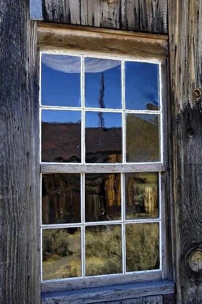 USA, California, Bodie State Historic Park, Ghost town building reflected in window