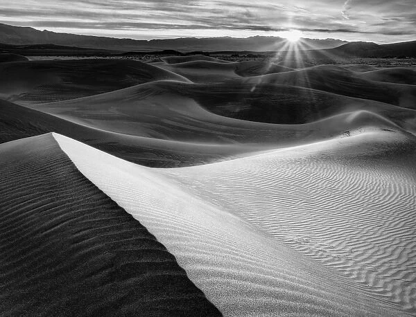 USA, California, Death Valley National Park, Sunrise over Mesquite Flat Dunes in black