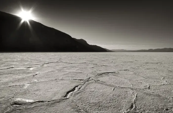 Framed Print : USA, California, Death Valley. Sunburst over salt pan of Badwater Basin. Credit as