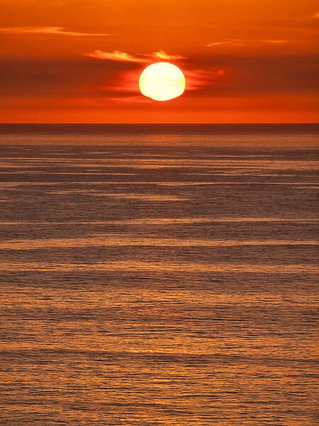 USA, California, La Jolla, Fiery sun drops into the Pacific Ocean