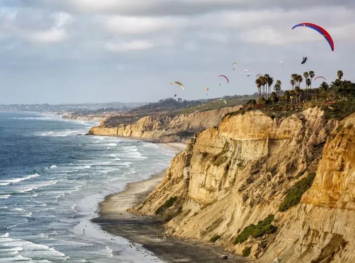 Framed Print : USA, California, La Jolla. Paragliders soar over Blacks Beach Framed Print : USA, California, La Jolla. Paragliders soar over Blacks Beach