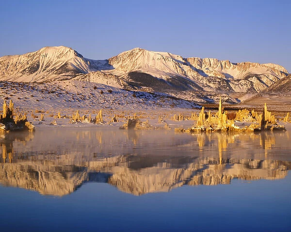 USA, California, Mono Lake. Hills and tufas reflect in lake. Credit as: Dennis Flaherty
